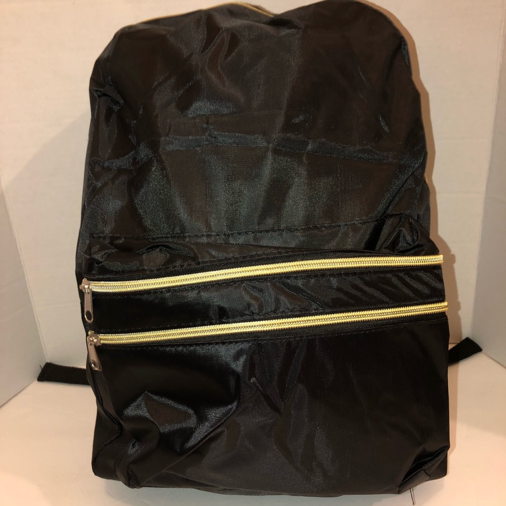 Black and gold metro pack back pack